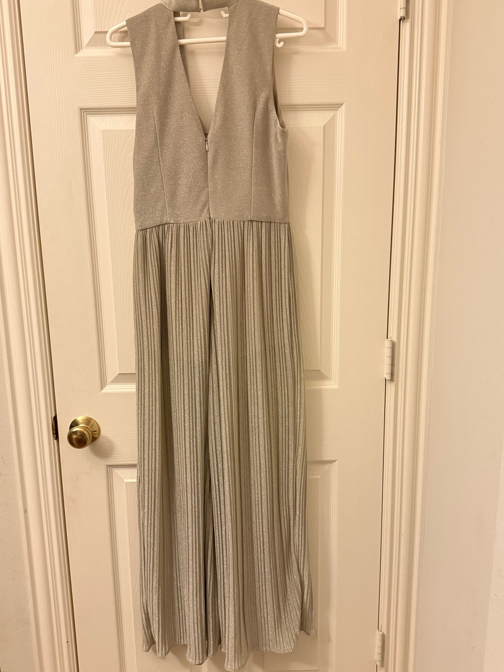 Adelyn Rae Silver Metallic V-Neck Sleeveless Jumpsuit with Flowing Pleated Legs View 2